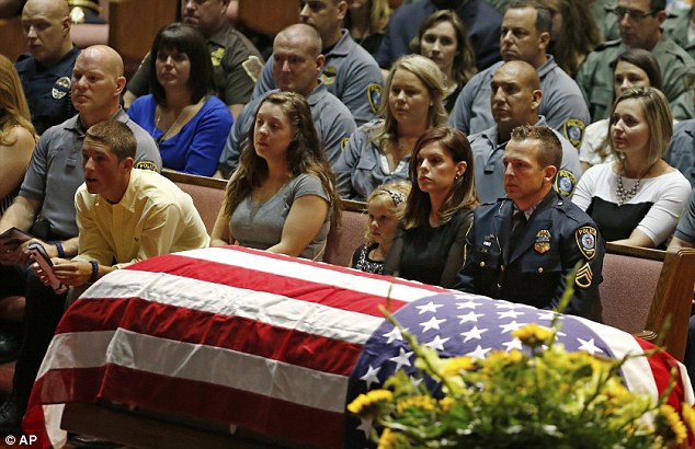 Sad: It was a packed house for Kye's Oklahoma City funeral. Sergeant Stark is on paid administrative leave pending an investigation because it is not legal to shoot to protect a canine